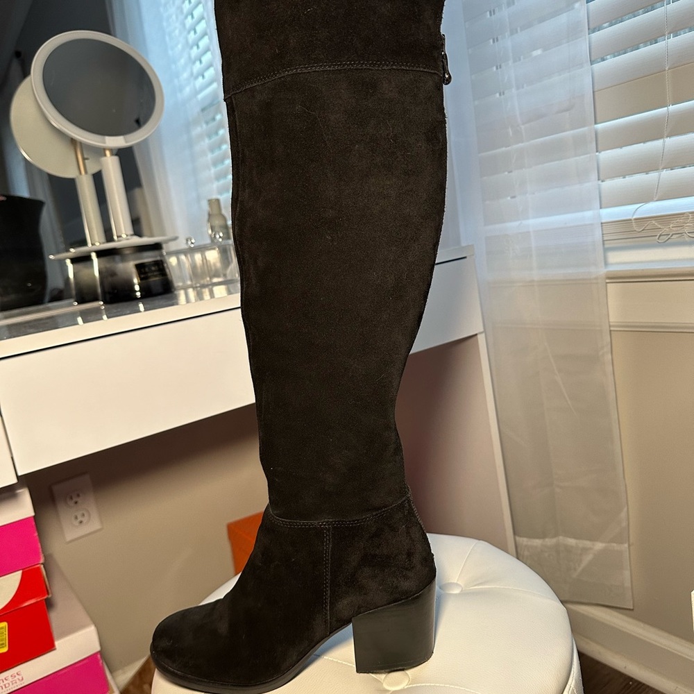 Steve Madden black tall boots.